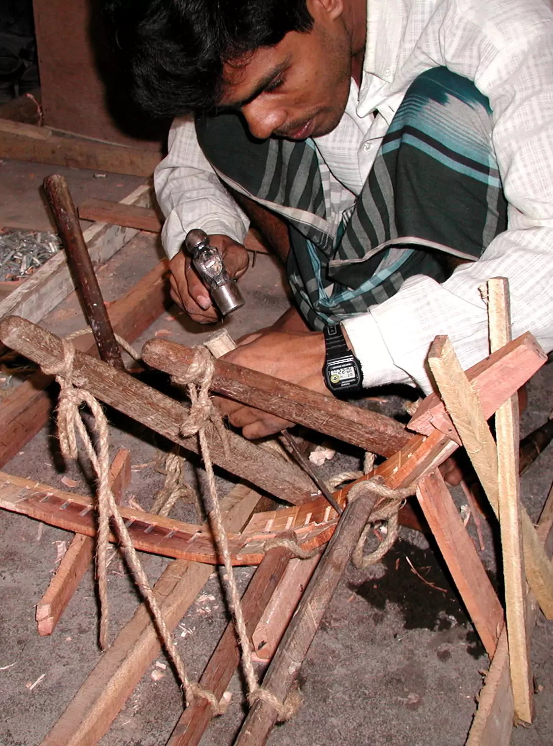 Master carpenters shaping handcrafted timber hulls using centuries-old techniques.