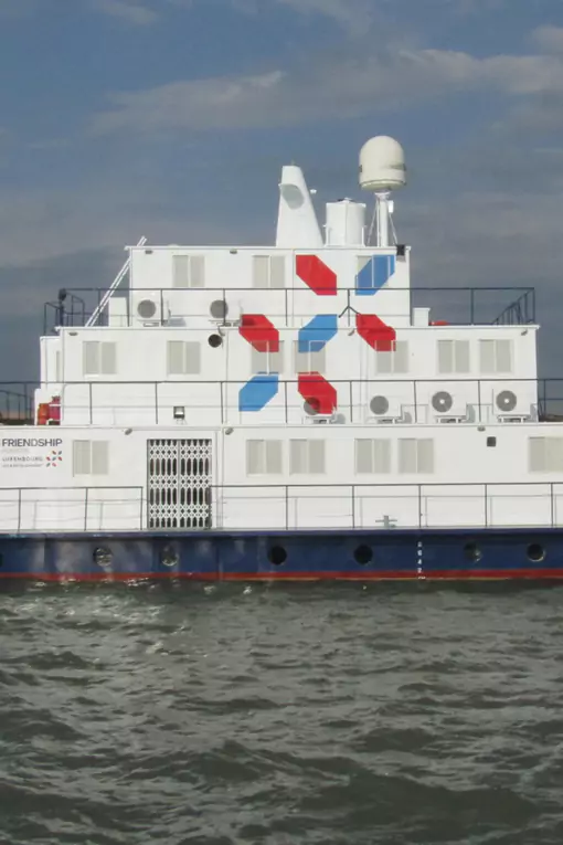 Lifebuoy Friendship Hospital vessel docked at a northern sandbar char.
